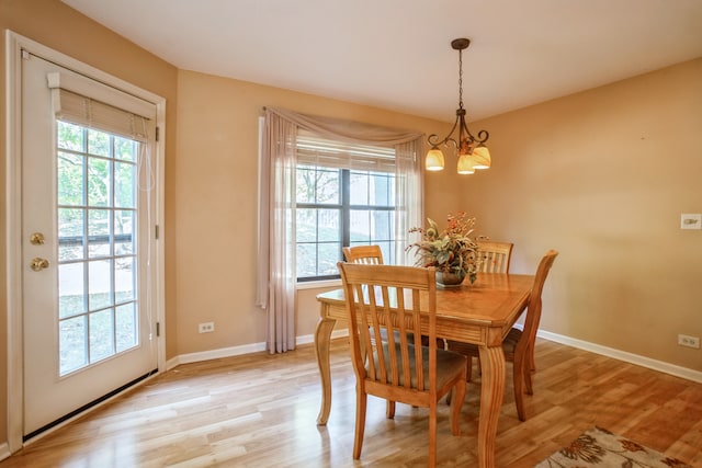 dining room featuring a chandelier and light hardwood / wood-style floors