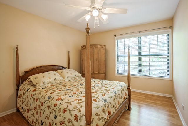 bedroom featuring light wood-type flooring and ceiling fan