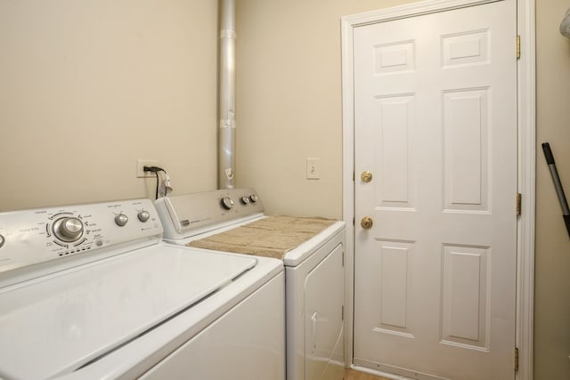 laundry room featuring separate washer and dryer