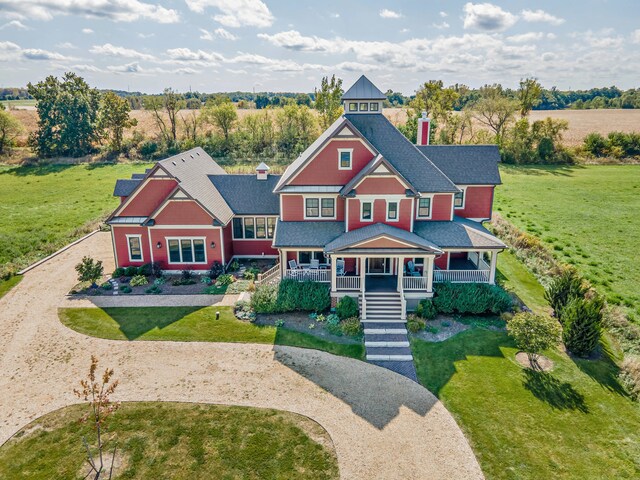 view of front of home with a front lawn and a porch