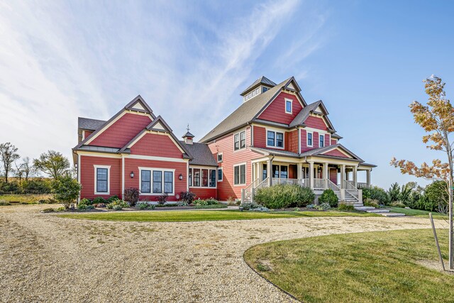 craftsman-style home featuring a front yard and a porch