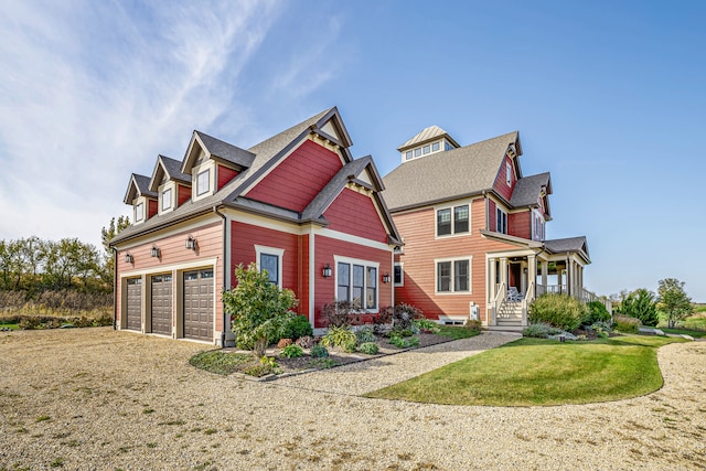 view of front of house featuring a garage and a front lawn