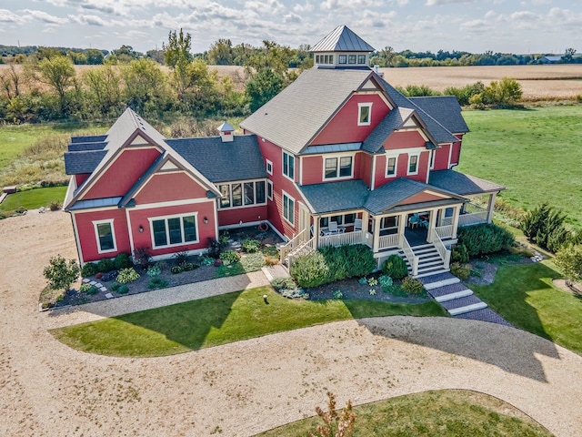 view of front of property featuring covered porch and a front yard