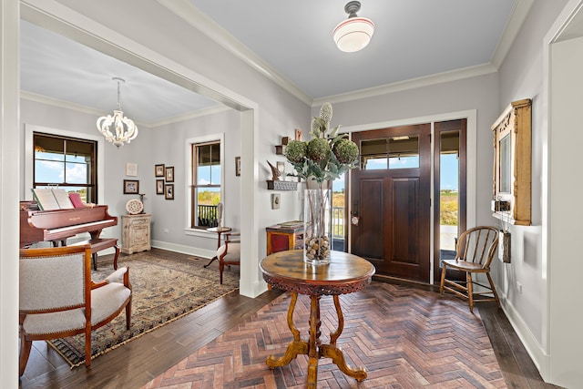 foyer entrance featuring ornamental molding and a notable chandelier