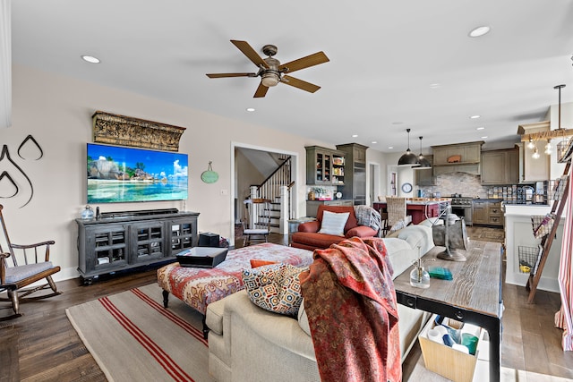 living room featuring dark hardwood / wood-style floors and ceiling fan