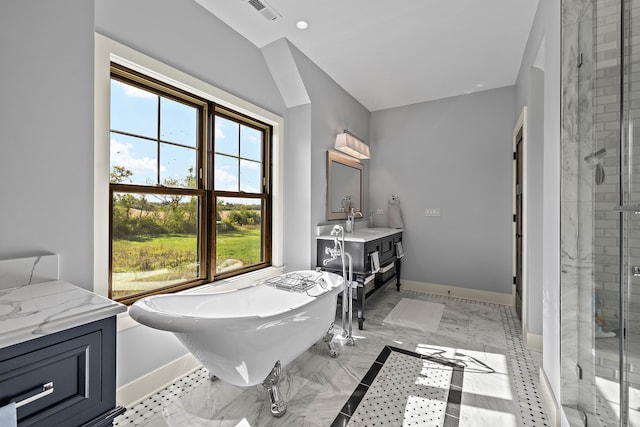 bathroom with vanity and independent shower and bath