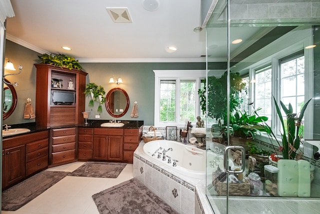 bathroom featuring vanity, tiled bath, plenty of natural light, and crown molding