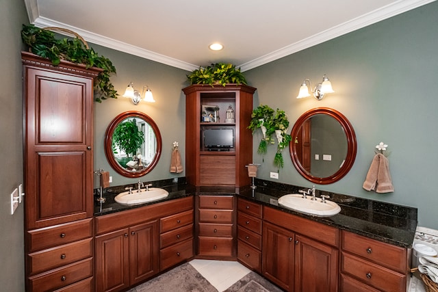 bathroom with vanity, crown molding, and tile patterned flooring