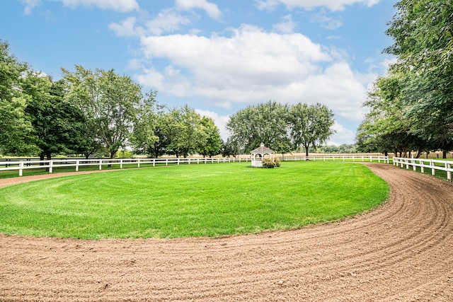 surrounding community with a lawn and a rural view