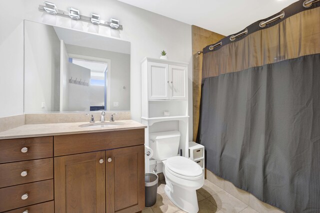 bathroom featuring tile patterned flooring, vanity, toilet, and a shower with shower curtain