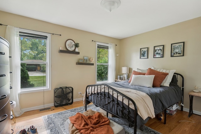 bedroom with light hardwood / wood-style floors