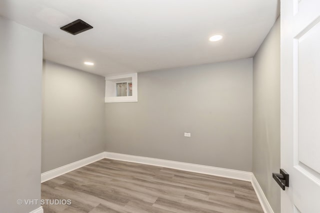 basement featuring light hardwood / wood-style flooring