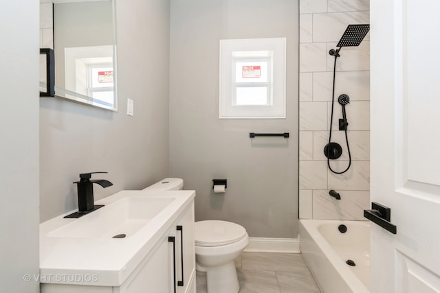 full bathroom with vanity, tiled shower / bath combo, toilet, and tile patterned flooring