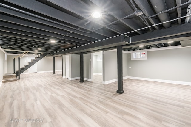 basement with hardwood / wood-style flooring