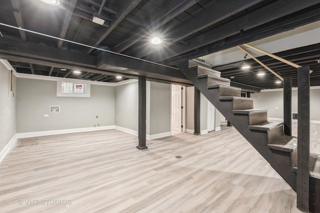 basement featuring light hardwood / wood-style flooring