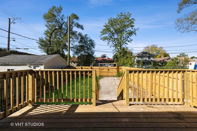 wooden deck with a yard