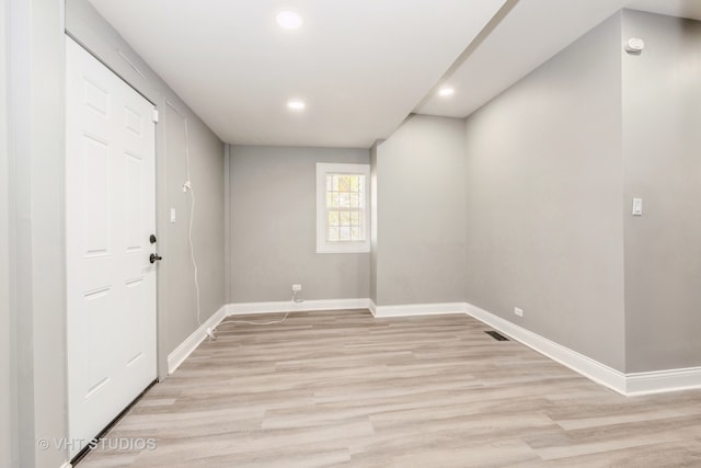 unfurnished room featuring light wood-type flooring