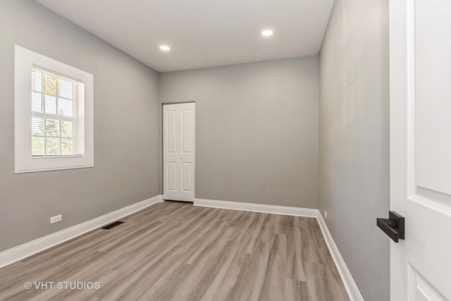 unfurnished room featuring light wood-type flooring