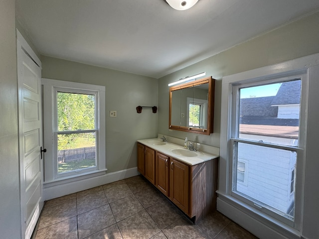 bathroom with tile patterned flooring and vanity