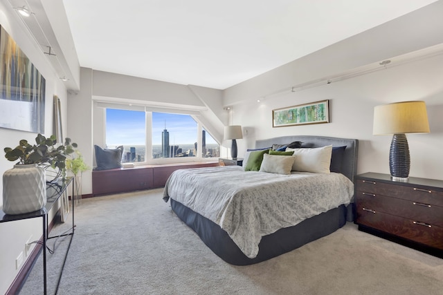 bedroom featuring light carpet