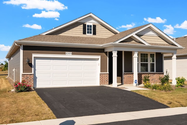 craftsman inspired home with a front lawn