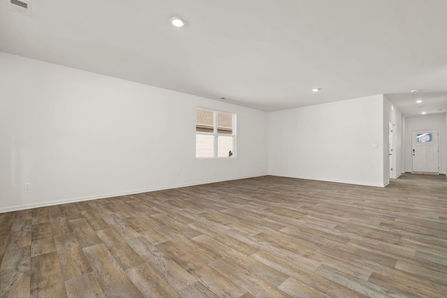 spare room featuring light hardwood / wood-style flooring