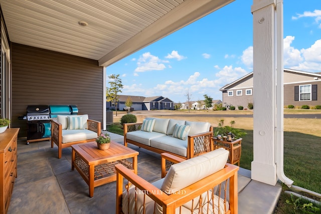 view of patio with outdoor lounge area and a grill