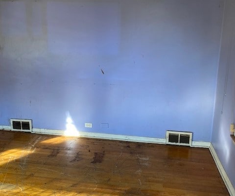 empty room featuring hardwood / wood-style flooring