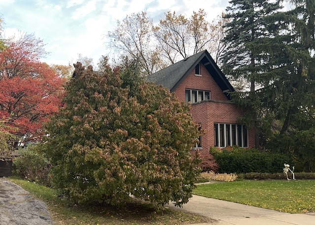 view of property exterior featuring a yard