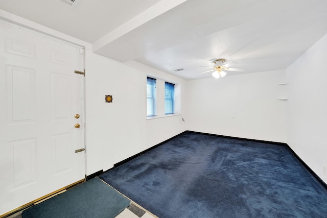 carpeted entrance foyer featuring ceiling fan