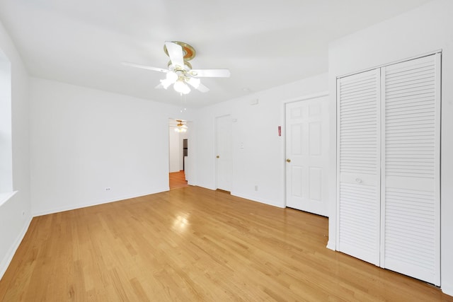 unfurnished bedroom featuring ceiling fan and light hardwood / wood-style flooring