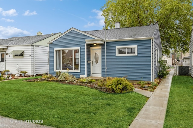 view of front of property with a front lawn