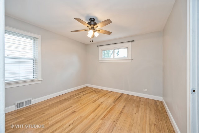 unfurnished room with ceiling fan and light hardwood / wood-style floors