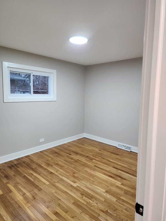 empty room with light hardwood / wood-style floors