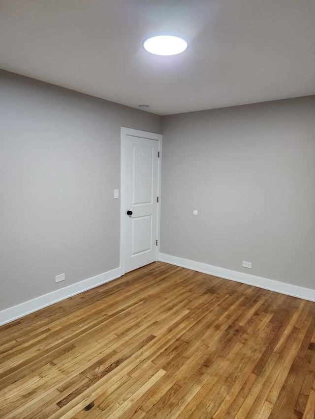 spare room featuring light hardwood / wood-style floors