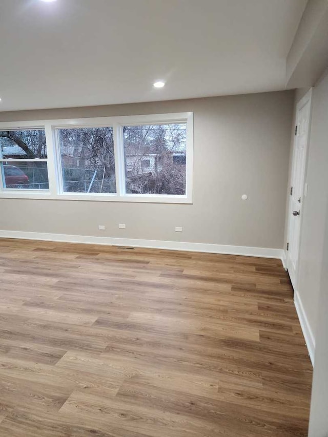 unfurnished room with light hardwood / wood-style floors