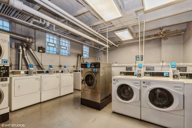 laundry room featuring plenty of natural light and separate washer and dryer