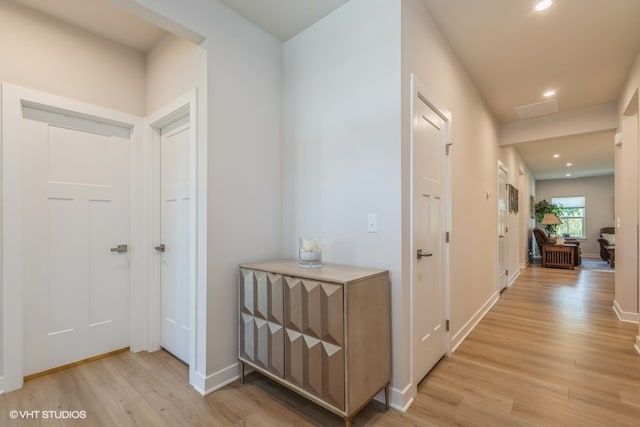 corridor featuring light hardwood / wood-style floors