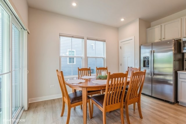 dining space featuring light hardwood / wood-style flooring