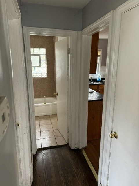 hallway with dark hardwood / wood-style floors