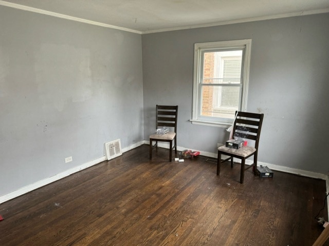 unfurnished room with ornamental molding and dark hardwood / wood-style floors