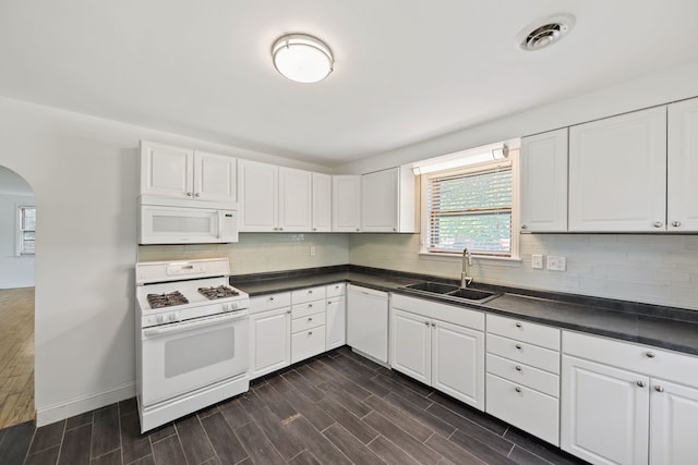 kitchen featuring white cabinets, white appliances, dark hardwood / wood-style floors, and sink