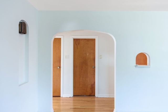 hall with light hardwood / wood-style floors