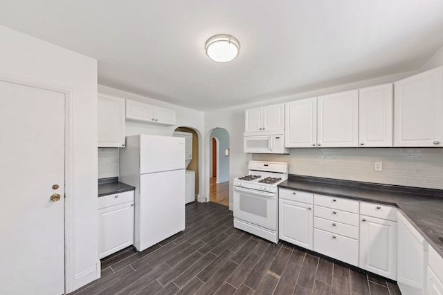 kitchen with decorative backsplash, white cabinets, white appliances, and dark hardwood / wood-style floors