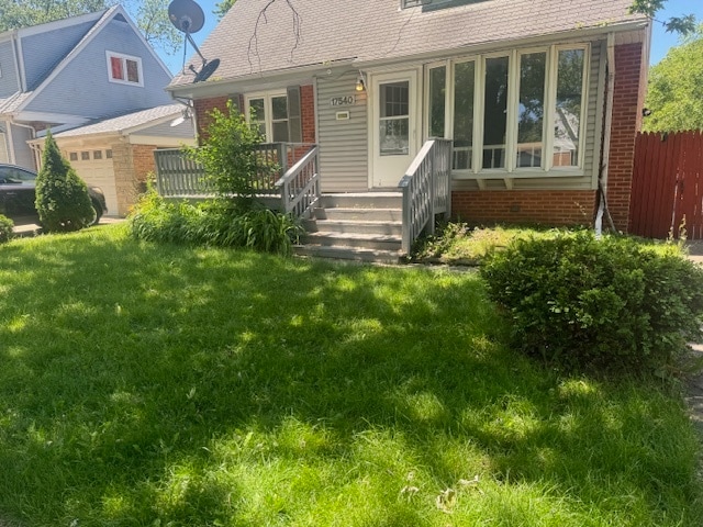 view of front of home with a front yard