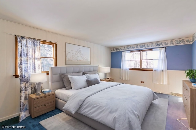 bedroom featuring dark carpet