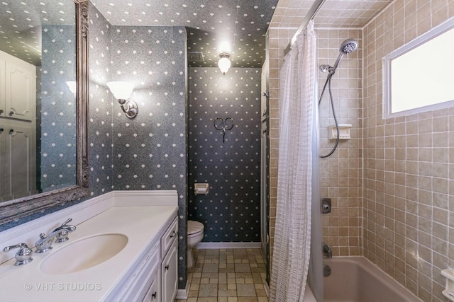 full bathroom with toilet, vanity, and shower / bath combination with curtain