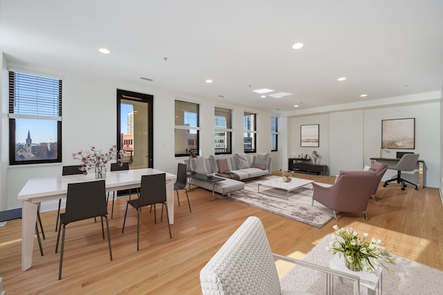 dining area featuring light hardwood / wood-style floors and plenty of natural light