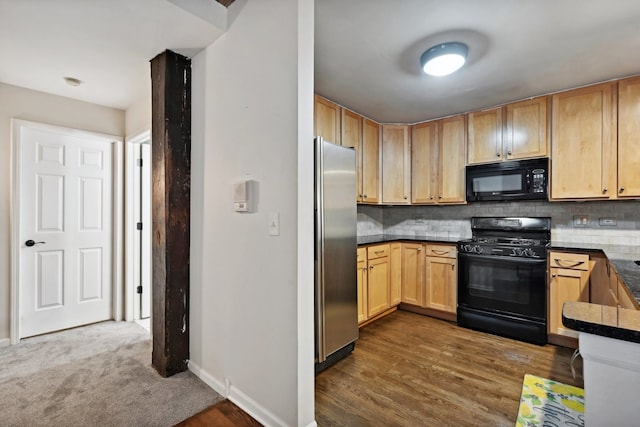 kitchen with black appliances, light brown cabinetry, backsplash, and dark hardwood / wood-style floors