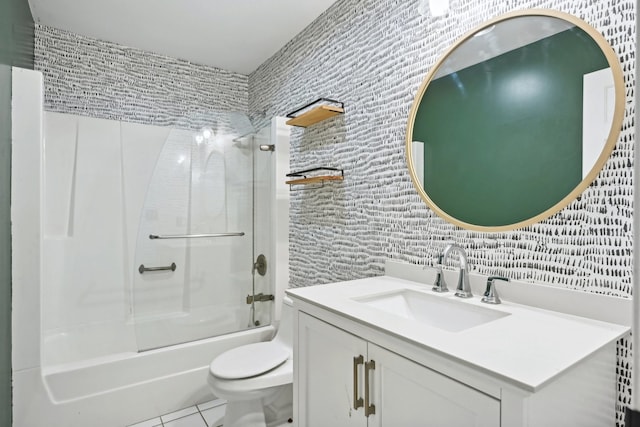 full bathroom with vanity, tile patterned flooring, toilet, and washtub / shower combination